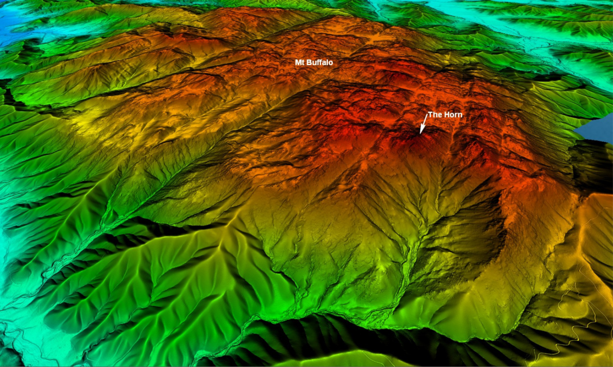 A derived image of Mount Buffalo and The Horn with the terrain and heights demonstrated using colour. The highest points are shaded in red, with the lowest valleys shown in aqua, and shades of yellow and green in between.